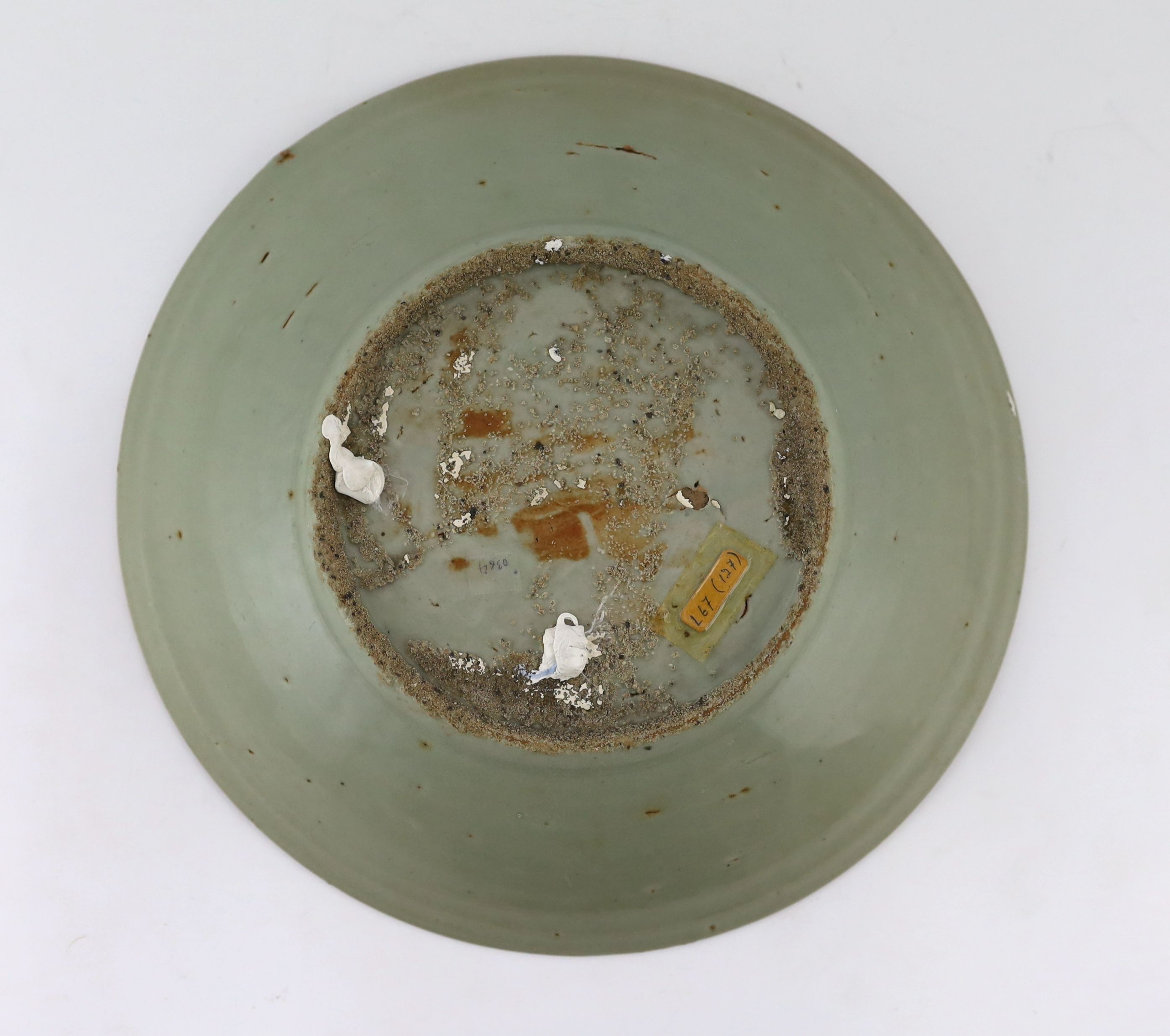 A Chinese celadon glazed sgraffito dish, Zhangzhou kilns, late 16th/early 17th century, 37cm diameter